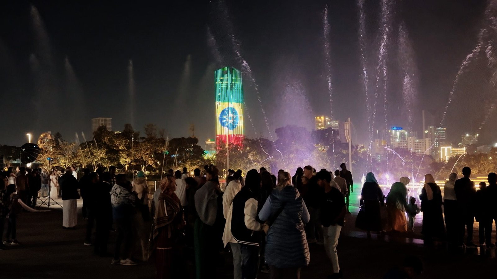 Evening crowds watching the fountain light show in Addis Ababa